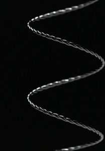 Metal coil on a black background